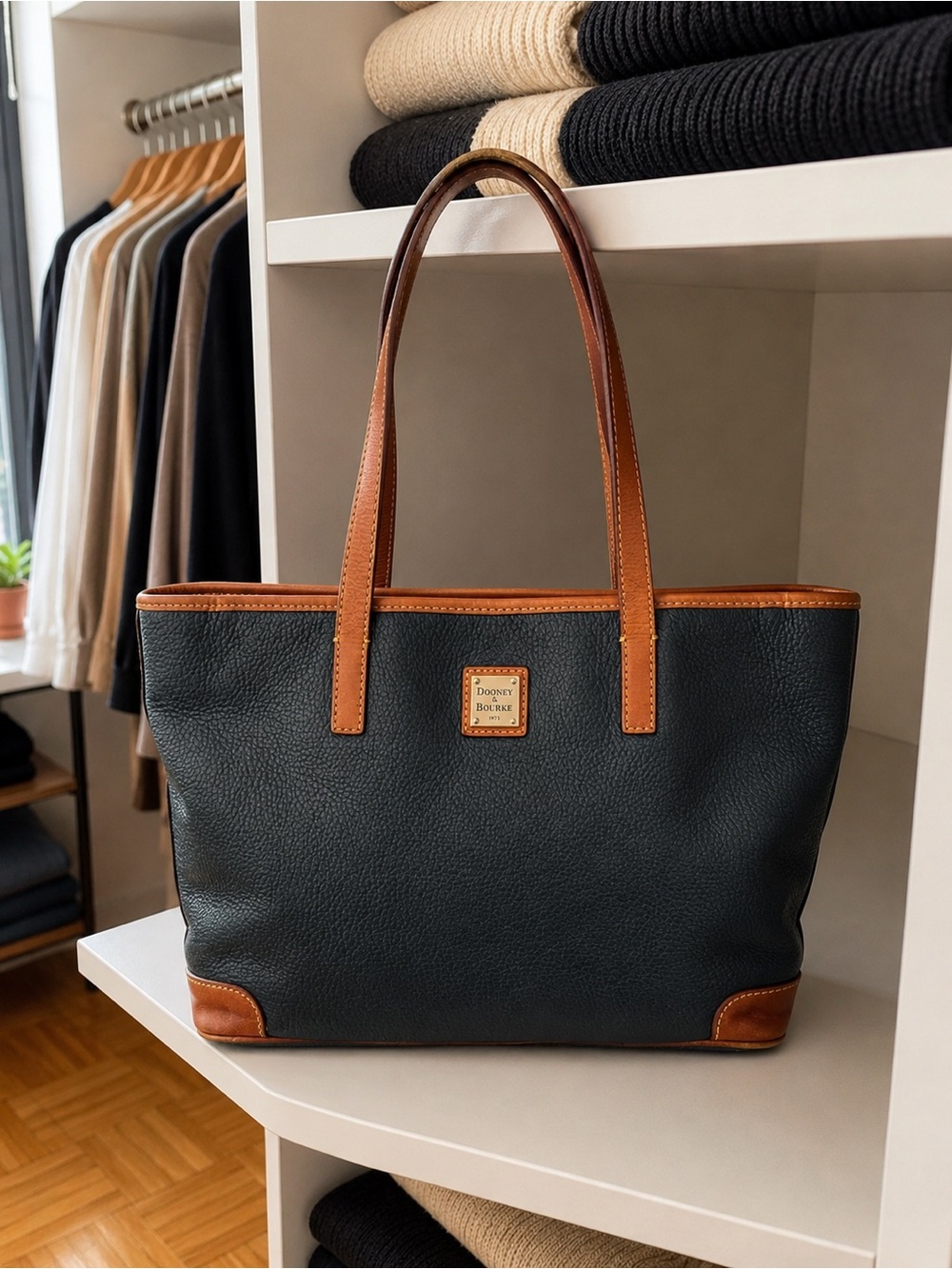 Dooney & Bourke Navy Pebbled Leather Tote with Tan Trim and Gold Plaque